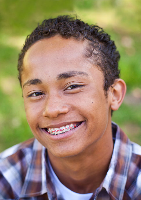 A boy with braces smiling