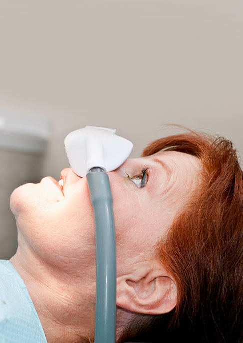 A woman under dental sedation